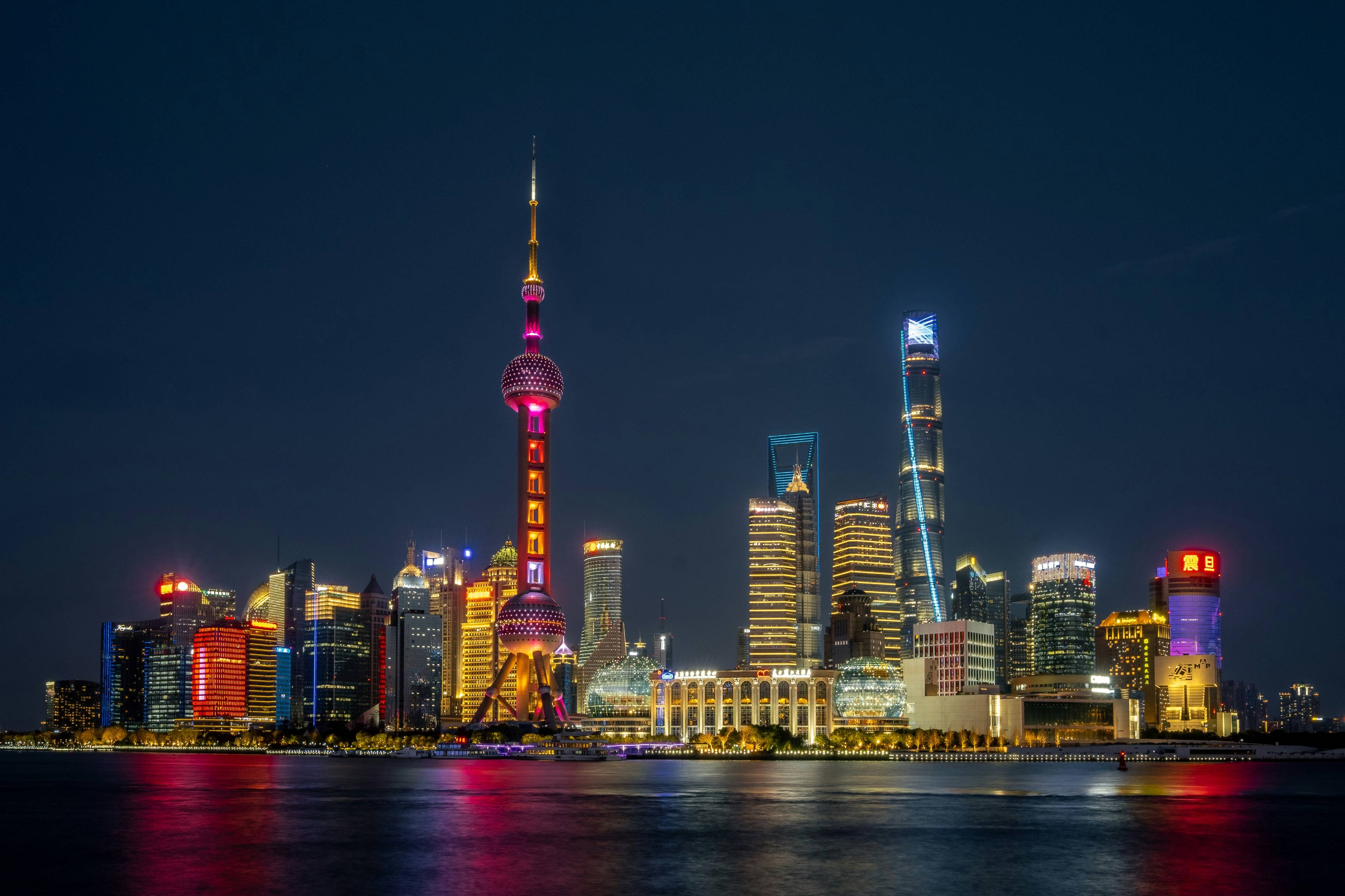 a view of a city at night from across the water