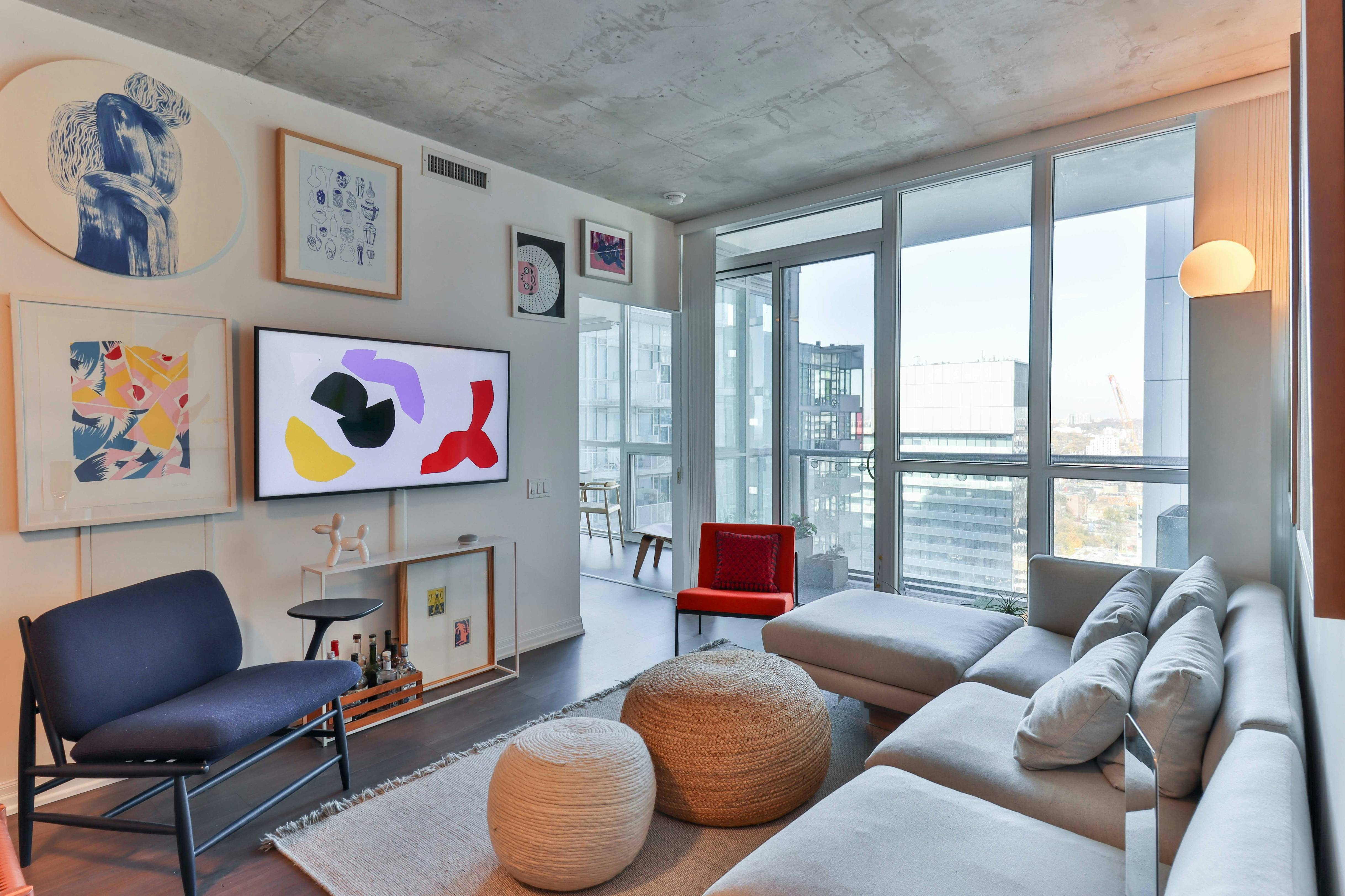 a living room filled with furniture and a flat screen tv