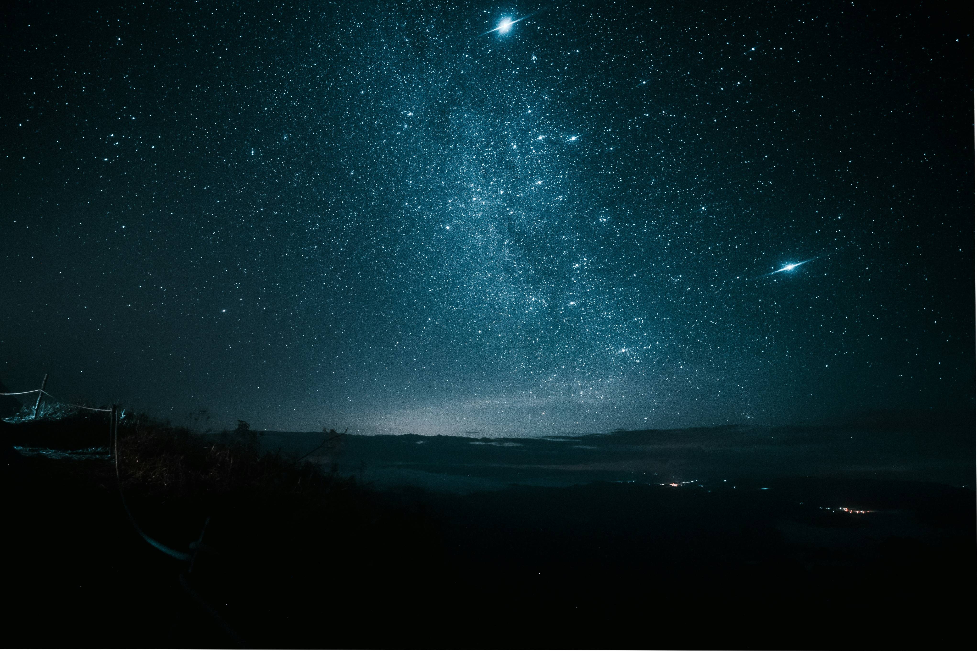 a night sky filled with stars and stars